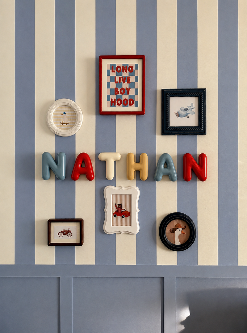 Door name sign spelling NATHAN in a framed gallery wall