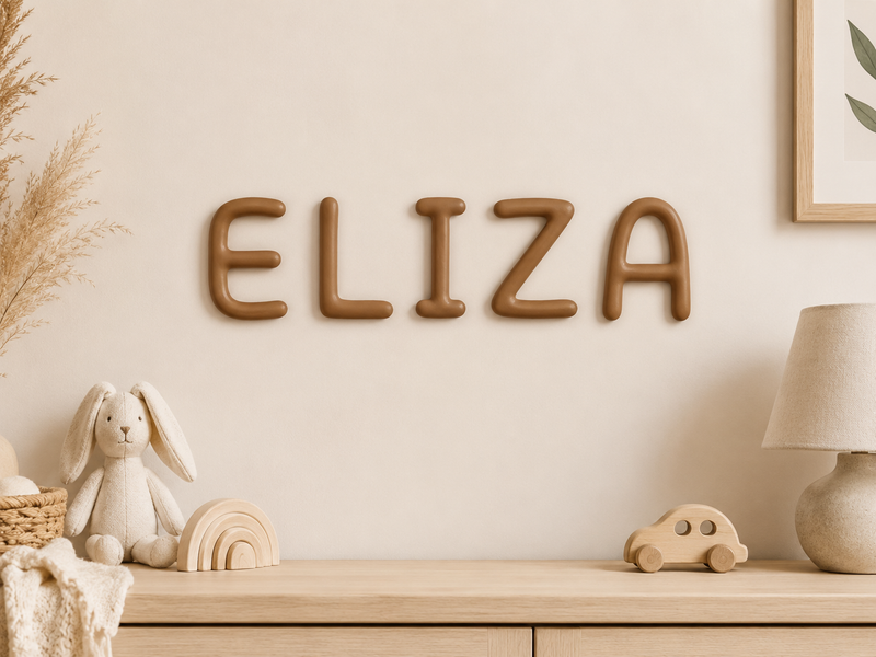 Name letters spelling ELIZA in earth brown above a dresser