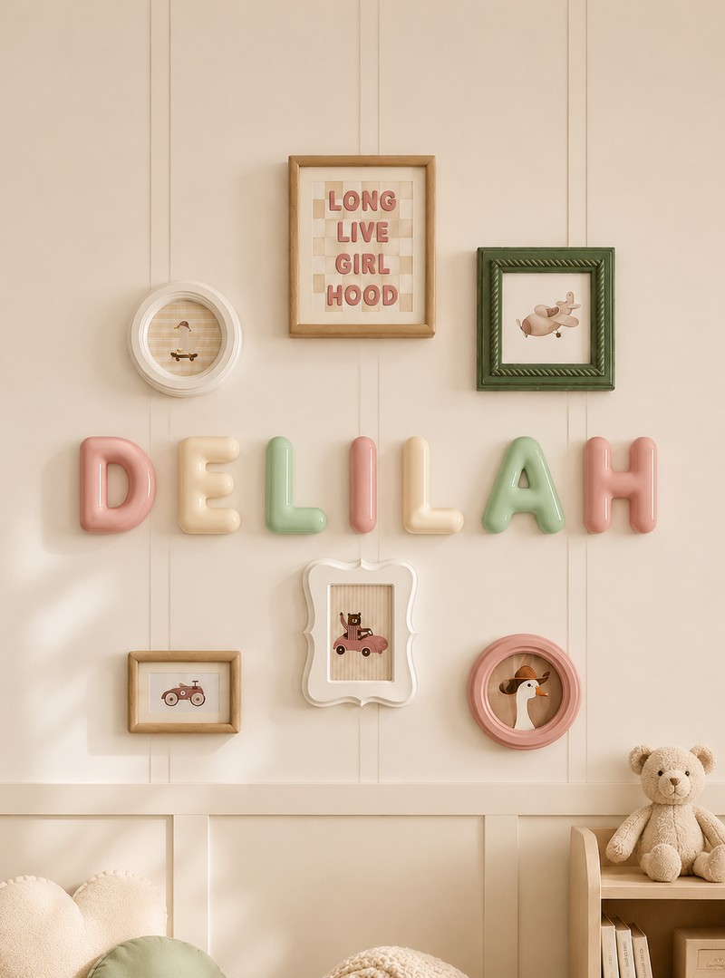 Door name sign spelling DELILAH on a cream panelled wall